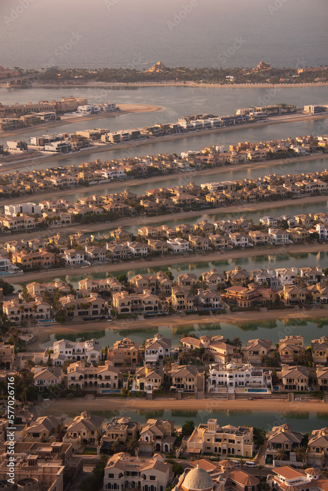 Palm Jumeirah island in Dubai on sunset, modern architecture, beaches and villas