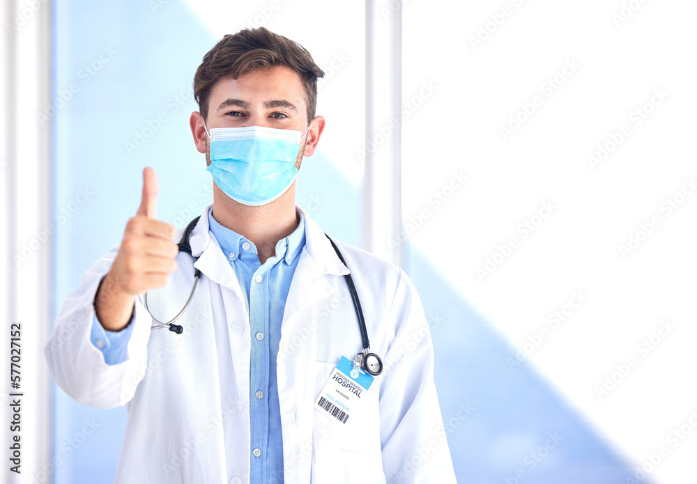 Portrait, doctor and man with thumbs up, mask and success for cure, diagnosis and safety compliance. Face cover, male and medical professional with gesture for ok, emoji and healthcare with mockup Portrait, doctor and man with thumbs up, mask and success for cure, diagnosis and safety compliance. Face cover, male and medical professional with gesture for ok, emoji and healthcare with mockup