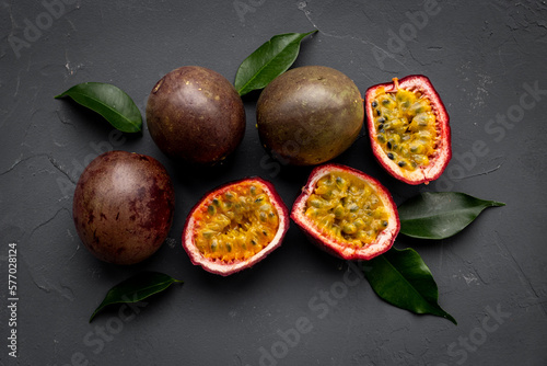 Flatlay of whole and half of fresh passion fruit - marakuya photo