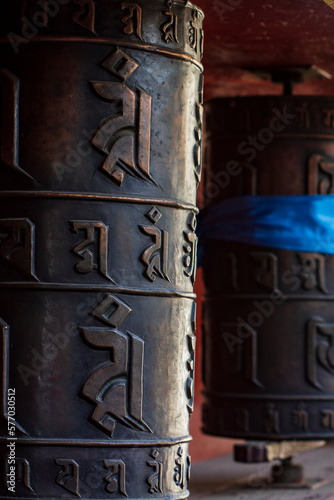 Prayer wheel cylindrical mantra religious Buddhist colorful objects near Betub Khiid temple