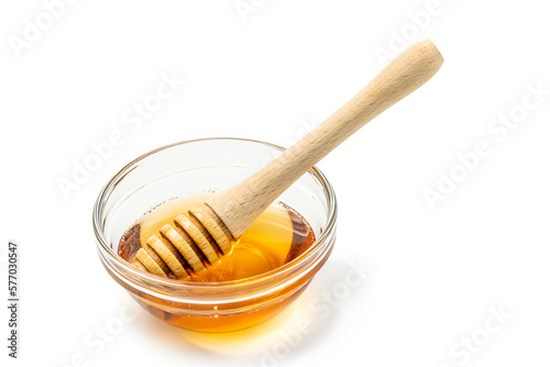 Honey bowl and dipper isolated on white background as package design element. Clipping path included