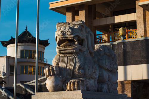 Buddhist Snow Lion stone sculpture protecting temple entrance of Gandan Kiidiin Zahirgaa