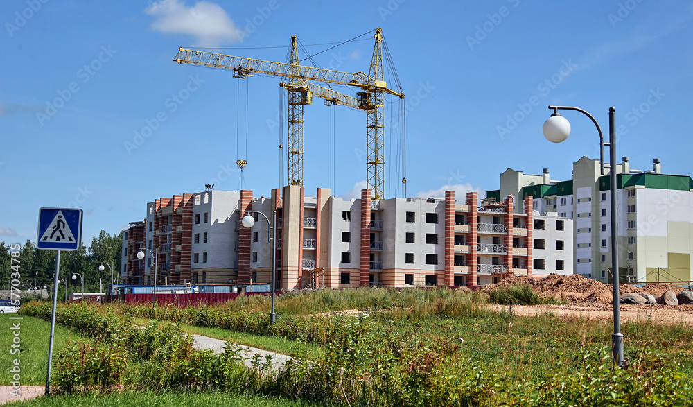 Panoramic view of construction sites and many cranes working