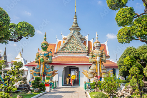 Two huge giant statues standing guard in Wat Arun are the symbol of this temple. Bangkok Thailand