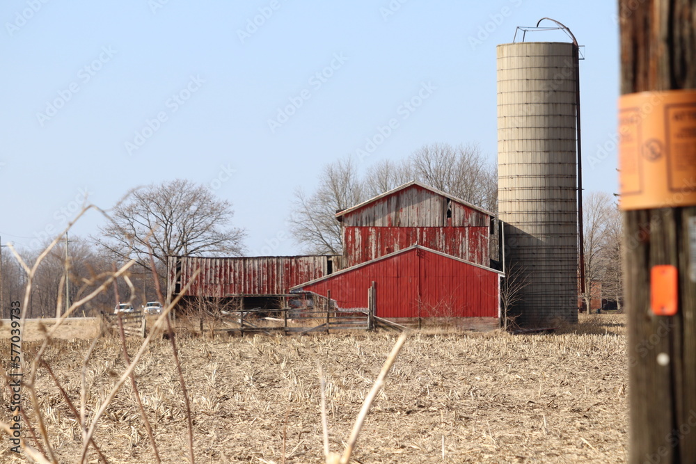Old barn across the harvested field Old barn across the harvested field