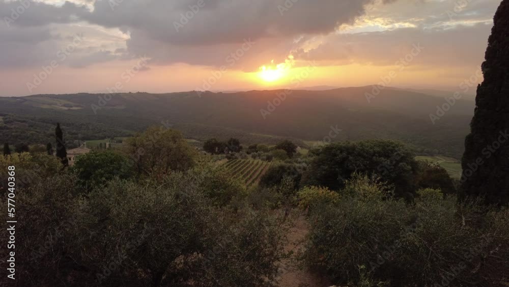 Panoramic sunset of terraced vineyards in winegrowing town Montalcino in Italian countryside and Tuscan-Emilian apennines. Heritage vineyards of Italy wine region. Tuscany region of Italy.