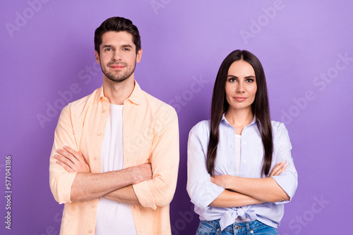 Photo of pretty charming husband wife dressed shirts arms folded isolated purple color background