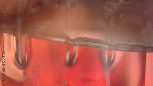 macro level view of water in bottle bright light