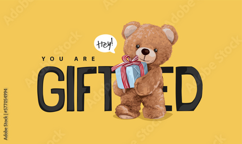 Fotografiet you are gifted slogan with brown bear doll holding gift box vector illustration