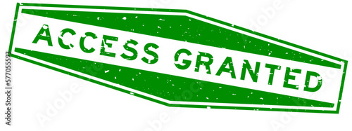 Grunge green access granted word hexagon rubber seal stamp on white background