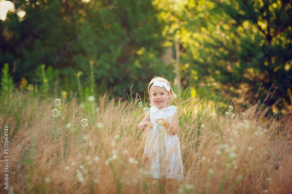 Happy little girl on summer field Happy little girl on summer field