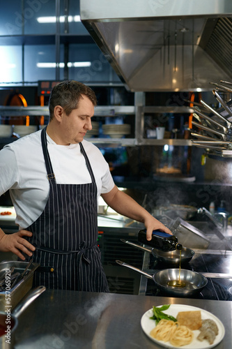 Professional chef cook making vegetarian Italian pasta