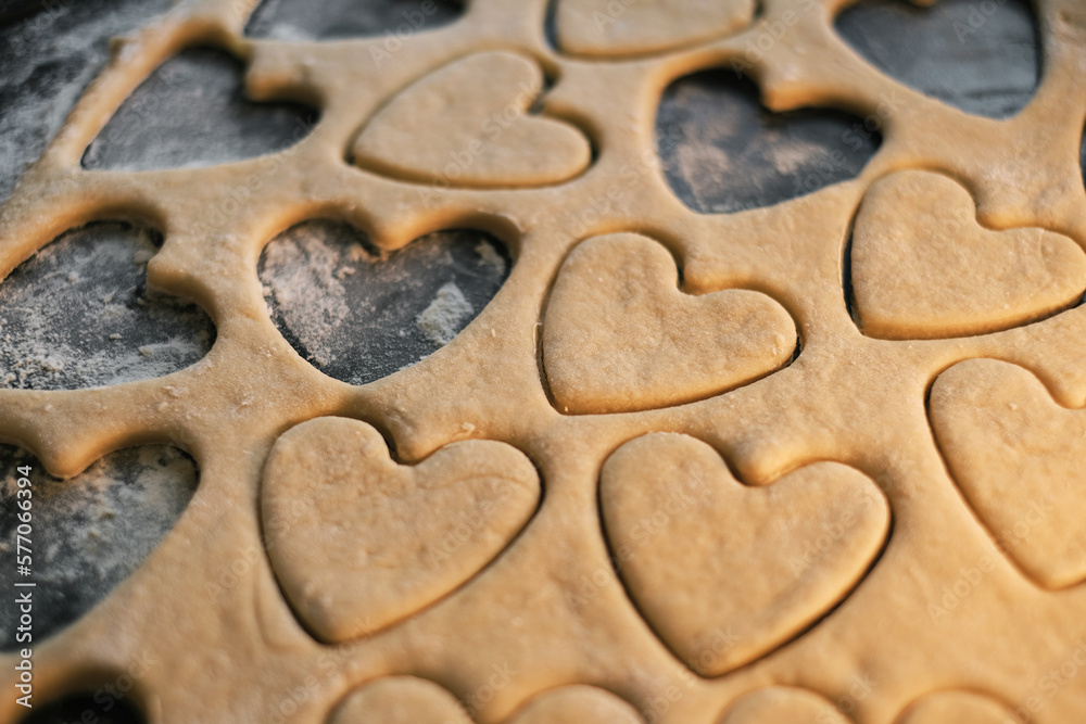 cooking heart shaped cookies in dough closeup