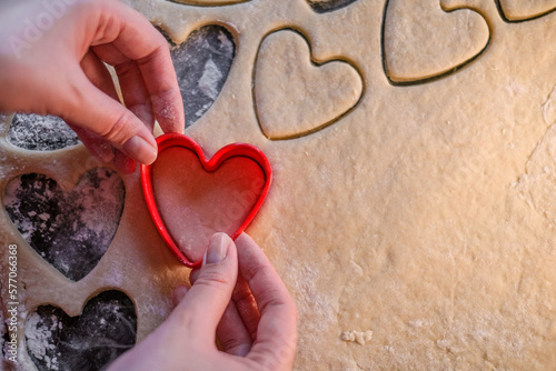 cooking heart shaped cookies in dough closeup