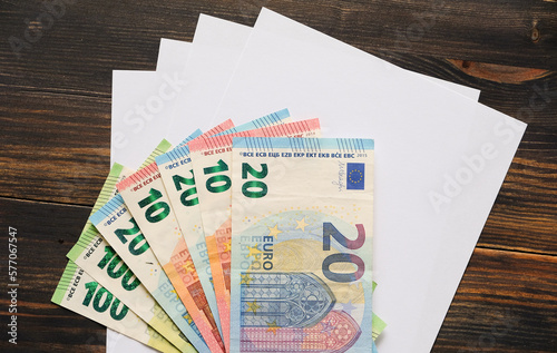 Euro banknotes on sheets of paper