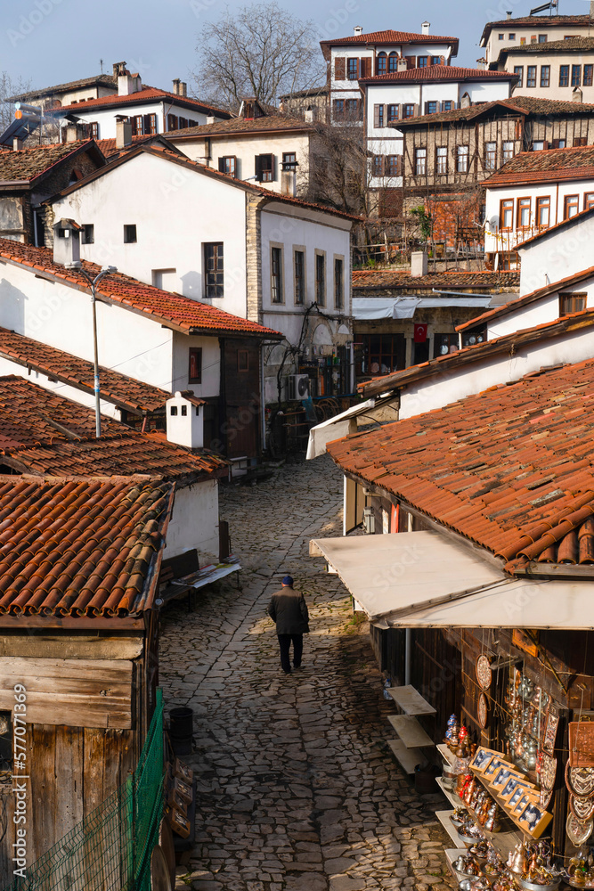 Traditional Turkish houses with an old lonely man in the street in Safranbolu, Karabuk, Turkey