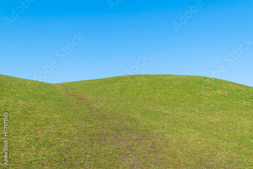 green hill and blue sky
