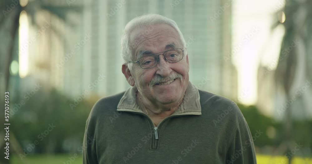 Senior man at park looking at camera with funny expression Senior man at park looking at camera with funny expression