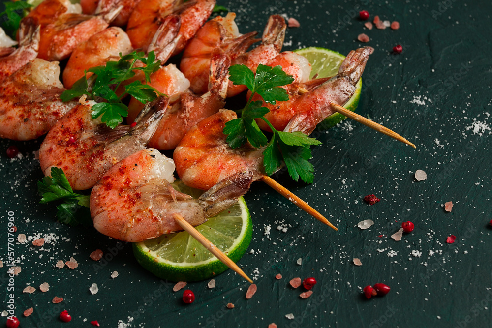 Shrimp kebab, with spices, lime, on wooden skewers, top view, no people,