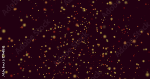 Image of yellow and red spots of light flying in hypnotic motion on black background