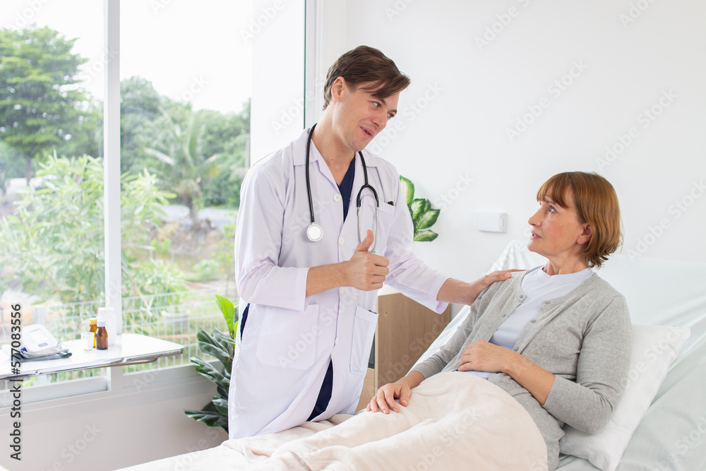 Fototapeta premium the doctor is examining the patient in the hospital Caucasian doctor wearing gown and a stethoscope talking to a female patient at the hospital
