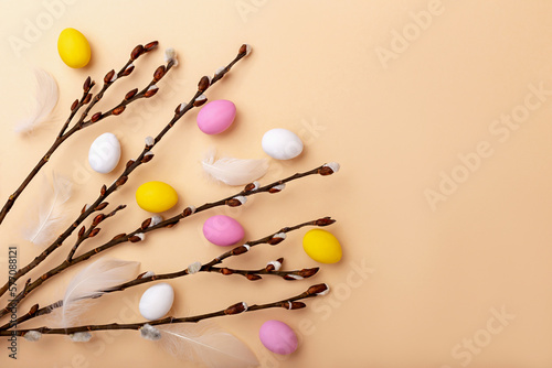 Willow branches with colorful Easter eggs and feathers
