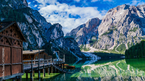 Lake surrounded by the mountains of the Italian alps. Fabulous views, magnificent mountains and lake. Free space for inscription text poster on backdrop nature Lake Braies emerald clear water. © eskstock