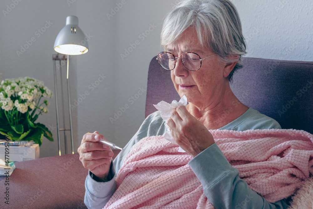 Elderly adult caucasian woman with cough and fever symptoms such as
