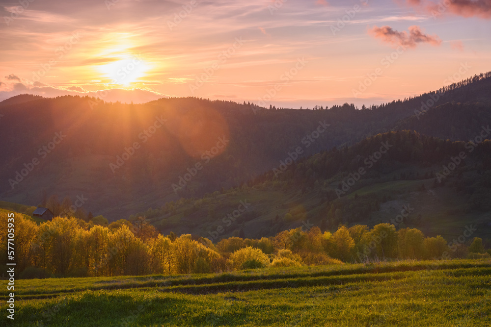 mountain pasture in vibrant colors of the sunset. perfect place for a relaxing vacation in the heart of rural nature mountain pasture in vibrant colors of the sunset. perfect place for a relaxing vacation in the heart of rural nature