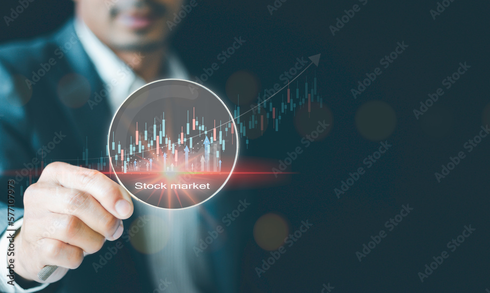 Stock market for analysis, technical graph, indicator, magnifier glass with virtual stock market chart, Business investment earning income Concept of growth planning and business strategy