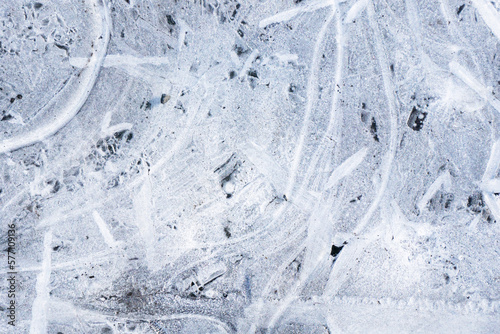 Snow background. Ice texture. Winter seanson pattern. Pile of snow. Nature pattern. Snowflake shine. Frozen puddle. Small pieces of ice. Cracked water freeze. White crystals texture.
