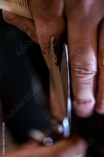 Barbershop, close-up of cutting hair. Vintage style. High quality photo