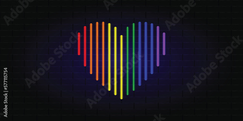 Neon glowing heart in the colors of the LGBT rainbow. Banner for LGBT Community Pride Month. Brick wall banner. Vector illustration
