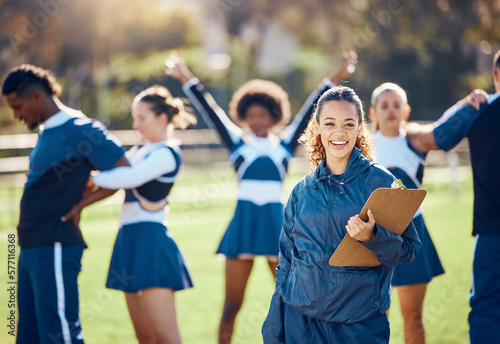 Cheerleader team  woman portrait and training coach with clipboard for practice  sports management and competition. Happy black woman or cheerleading checklist for coaching group of people outdoor