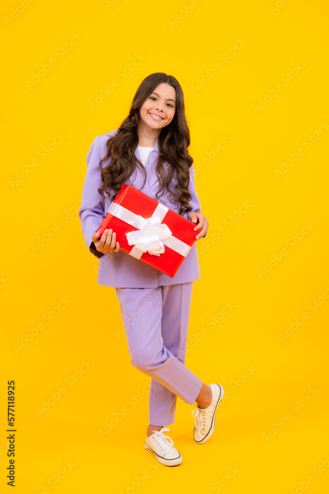 Portrait of teenager child girl 12, 13, 14, years old holding Christmas gift box. Teen giving birthday gift. Portrait of teenager child girl 12, 13, 14, years old holding Christmas gift box. Teen giving birthday gift.