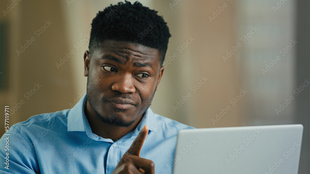 © Yuliia - Angry annoyed man african businessman boss talk in video conference use computer arguing conflict quarrel complain bad service talking distant shout solve business problem expressing negative feedback