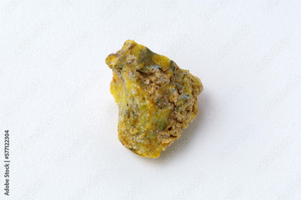 Rough yelow opal crystal, unpolished mineral. Close-up, white background Rough yelow opal crystal, unpolished mineral. Close-up, white background