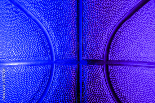 Closeup detail of basketball ball texture background. Blue neon. Banner Art concept © Augustas Cetkauskas