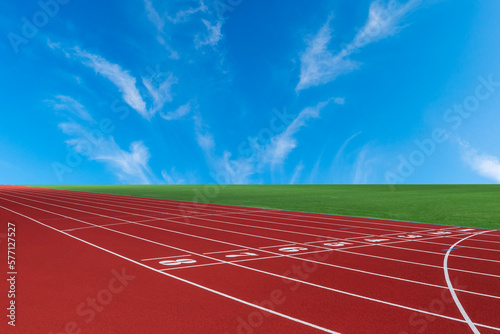 Red running track and blue sky in stadium. Sport theme background. Horizontal sport theme poster, greeting cards, headers, website and app