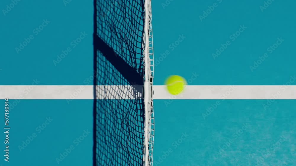 Tennis Court Aerial View Playing Game. Camera Rising Above the Flying Ball and Net. Ball Flies from Side to Side. Sport Concept 4k UHD 3840x2160.