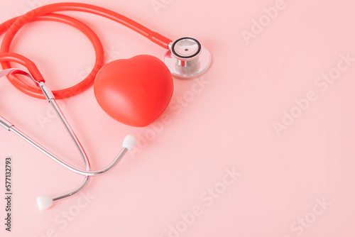 Red heart with doctor physician's stethoscope, World heart health day, doctor day. photo