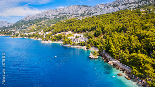 Enjoy the view of Croatia's beach from above, where turquoise waters meet soft sands. Relax and find adventure in this beautiful vacation spot, captured in stunning aerial photography. © Sebastian
