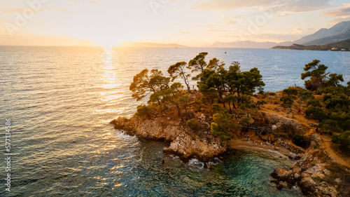 A drone captured the stunning aerial view of Croatia's coastal area, which features crystal-clear blue water and lush forests on land.