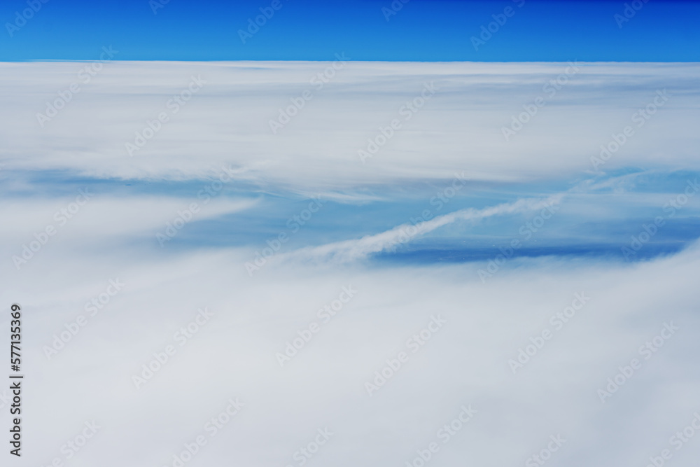 A large amount of clouds covering a wide area seen from 10,000 feet