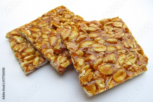 Peanut chikki bar on white background photo