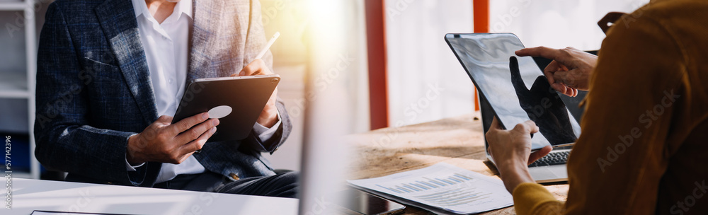 Team Of Business working at office with documents on his desk, doing planning analyzing the financial report, business plan investment, finance analysis concept Team Of Business working at office with documents on his desk, doing planning analyzing the financial report, business plan investment, finance analysis concept