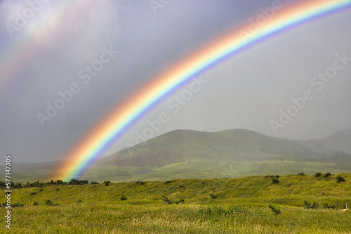 rainbow over the ,fields and mountains