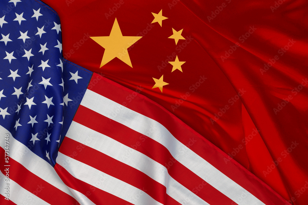 American and Chinese flags together. Background for political and economic concepts. National symbols of North America and Asia.