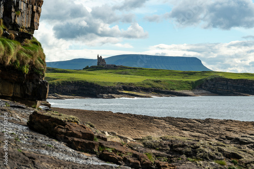 Distant view of Classiebawn castle at the coast of Mullaghmore Head, County Sligo, Ireland photo
