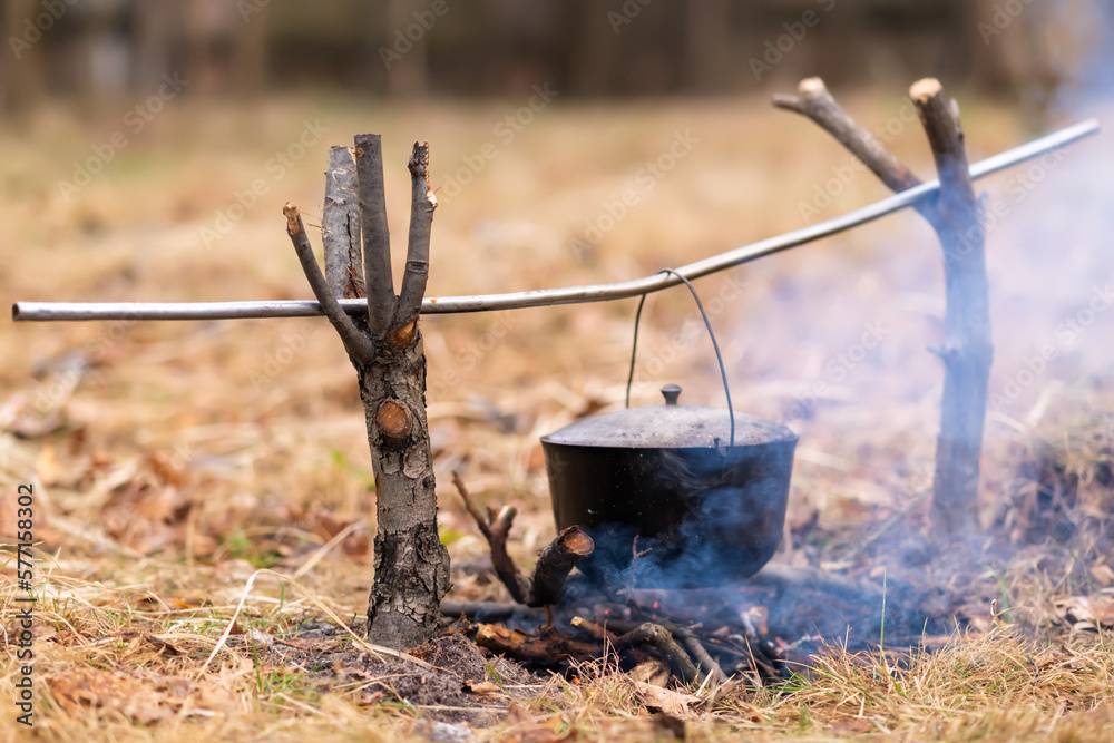 Pot with cooking on an open fire